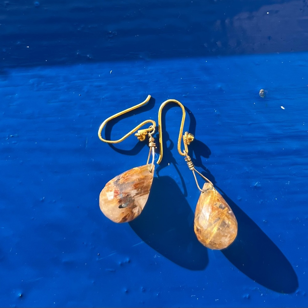Gold stone drop earrings.